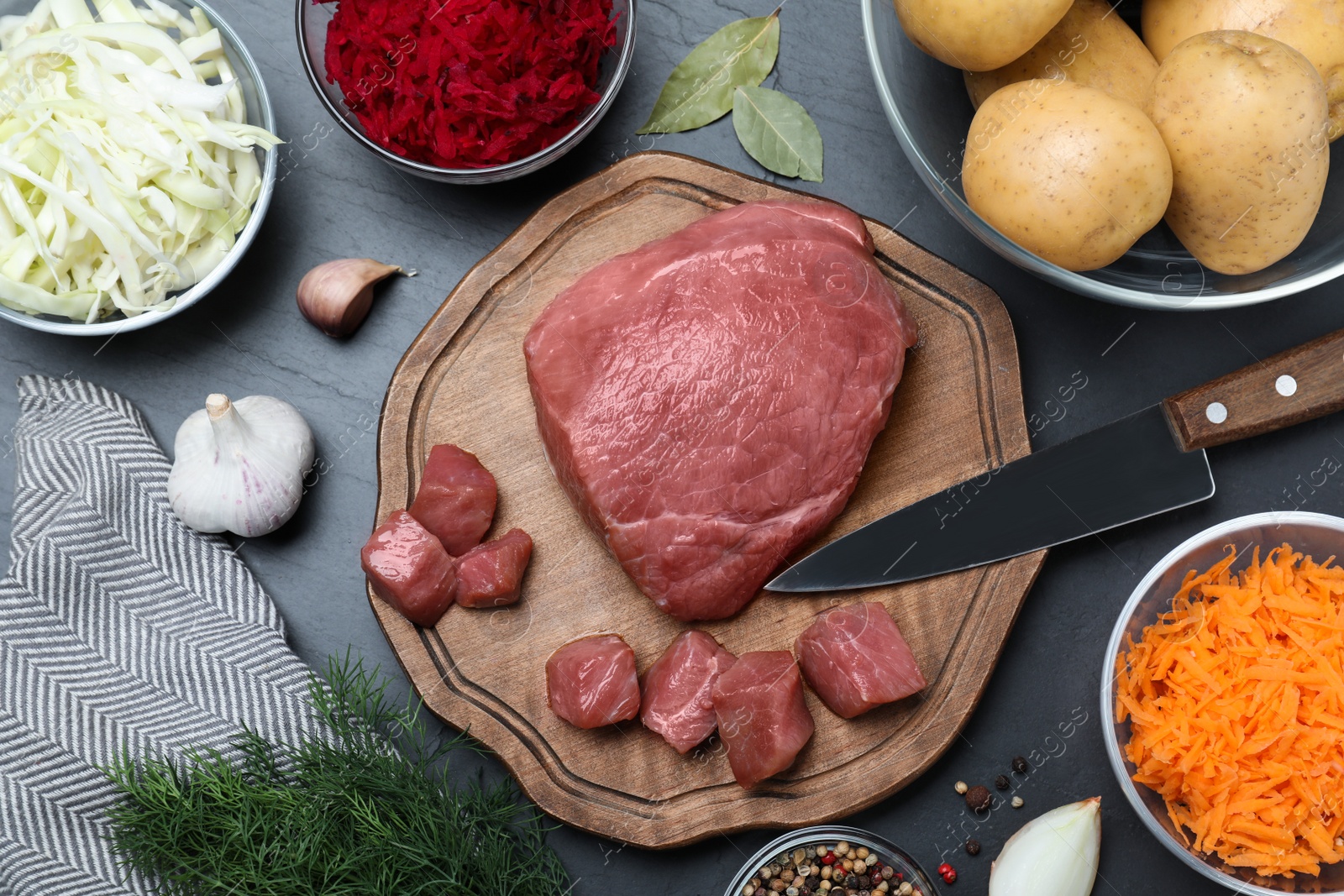 Fresh ingredients for borscht on black table, flat lay Photo of Fresh ingredients for borscht on black table, flat lay