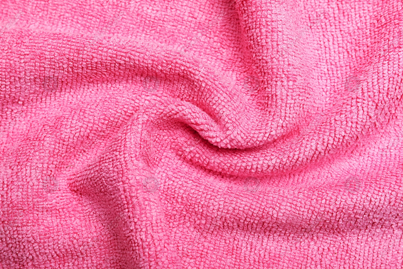 Crumpled pink microfiber cloth as background, closeup Photo of Crumpled pink microfiber cloth as background, closeup