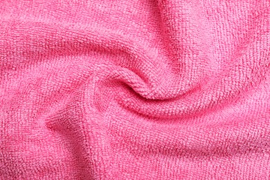 Crumpled pink microfiber cloth as background, closeup Photo of Crumpled pink microfiber cloth as background, closeup