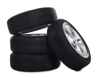 Set of wheels with winter tires on white background Photo of Set of wheels with winter tires on white background