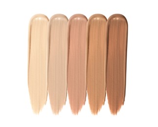 Different shades of liquid skin foundation on white background, top view Image of Different shades of liquid skin foundation on white background, top view