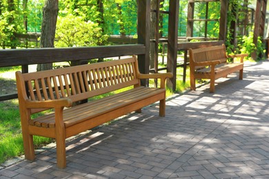 Beautiful view of wooden bench in park Photo of Beautiful view of wooden bench in park