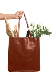 Woman holding leather shopper bag on white background, closeup Photo of Woman holding leather shopper bag on white background, closeup