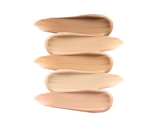 Different shades of liquid skin foundation on white background, top view Image of Different shades of liquid skin foundation on white background, top view