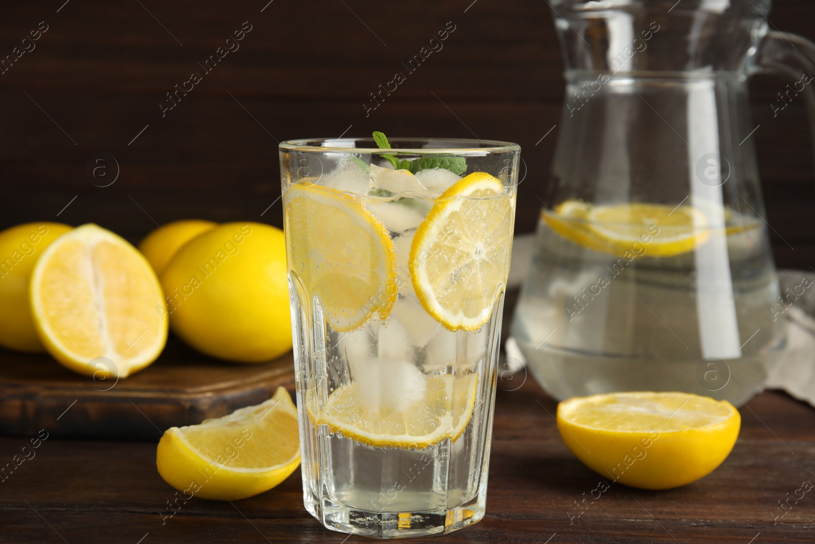 Cool freshly made lemonade on wooden table Photo of Cool freshly made lemonade on wooden table