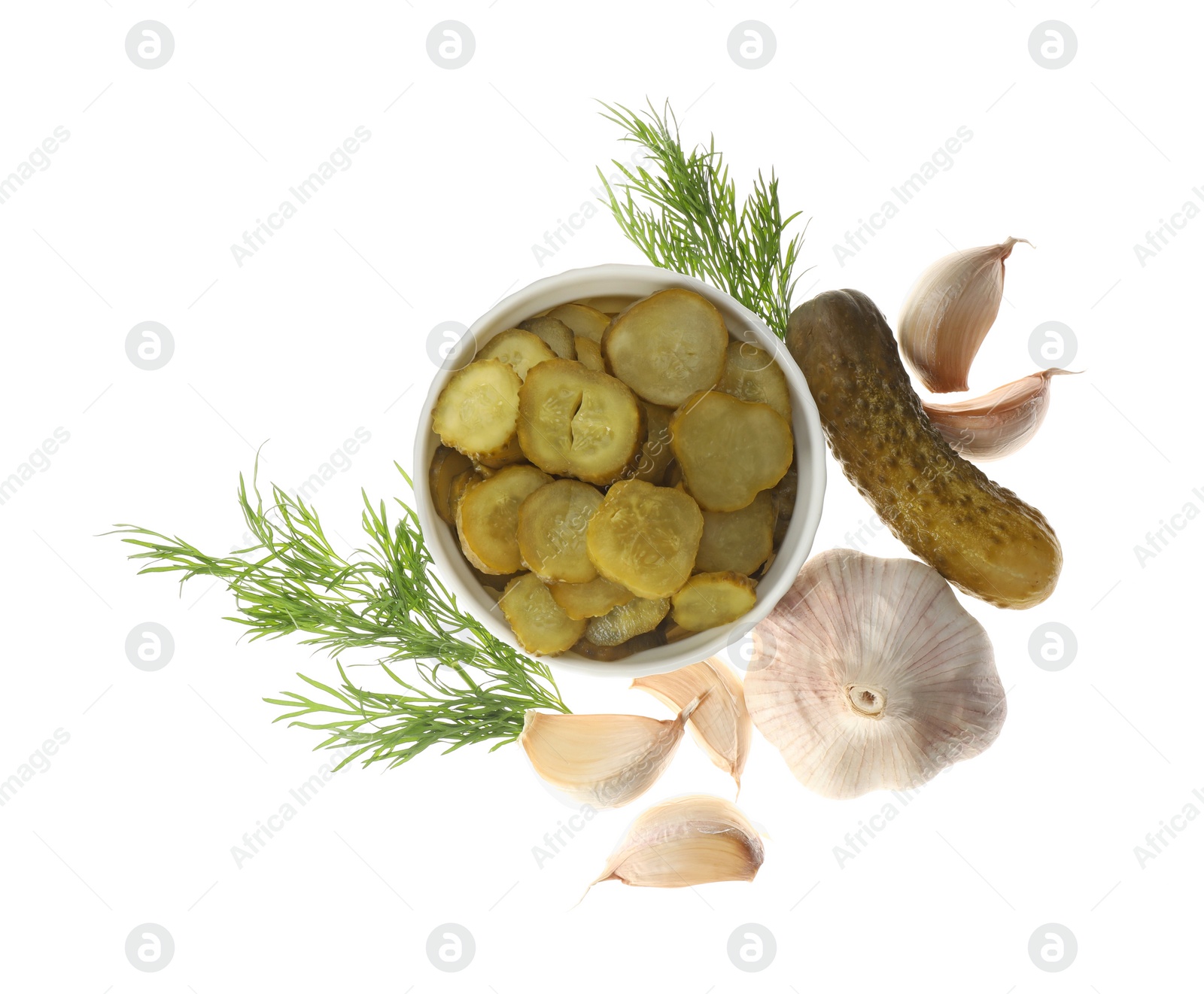Tasty pickled cucumbers, garlic and dill on white background, top view Photo of Tasty pickled cucumbers, garlic and dill on white background, top view