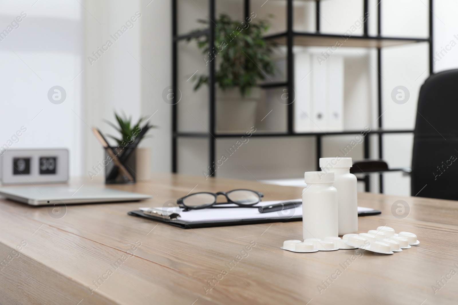 Modern doctor's workplace in office. Interior design Photo of Modern doctor's workplace in office. Interior design