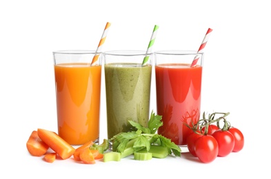 Delicious vegetable juices and fresh ingredients on white background Photo of Delicious vegetable juices and fresh ingredients on white background