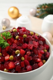 Traditional Russian salad vinaigrette in bowl, closeup Photo of Traditional Russian salad vinaigrette in bowl, closeup