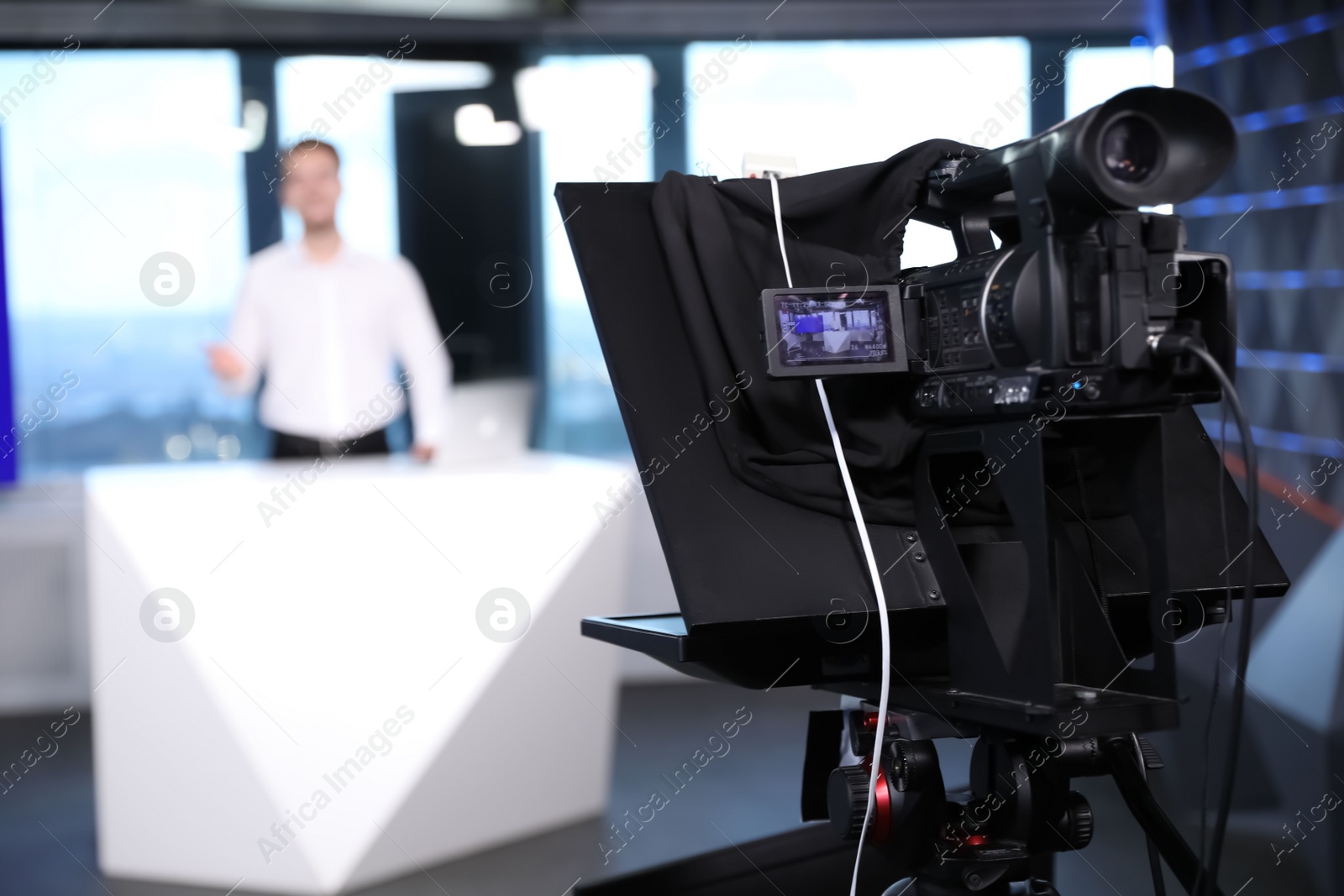 Presenter working in studio, focus on video camera Photo of Presenter working in studio, focus on video camera