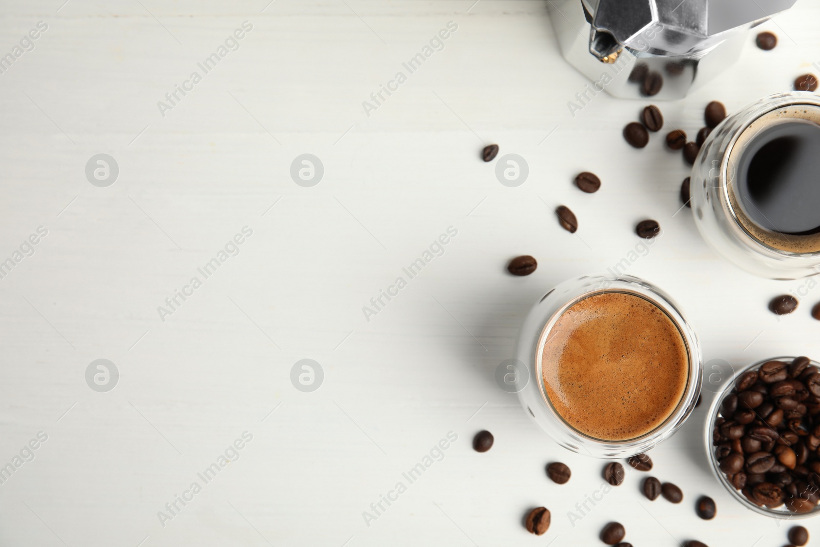 Tasty coffee and beans on white wooden table, flat lay. Space for text Photo of Tasty coffee and beans on white wooden table, flat lay. Space for text