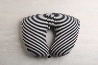 Striped travel pillow on light background, top view Image of Striped travel pillow on light background, top view