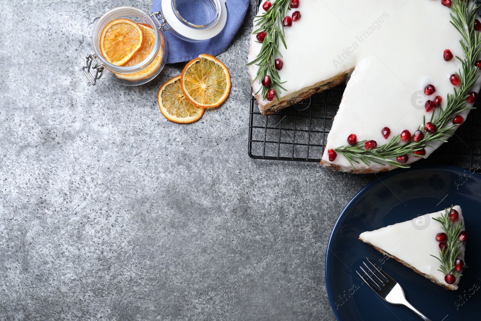 Flat lay composition with traditional Christmas cake on grey table. Space for text Photo of Flat lay composition with traditional Christmas cake on grey table. Space for text