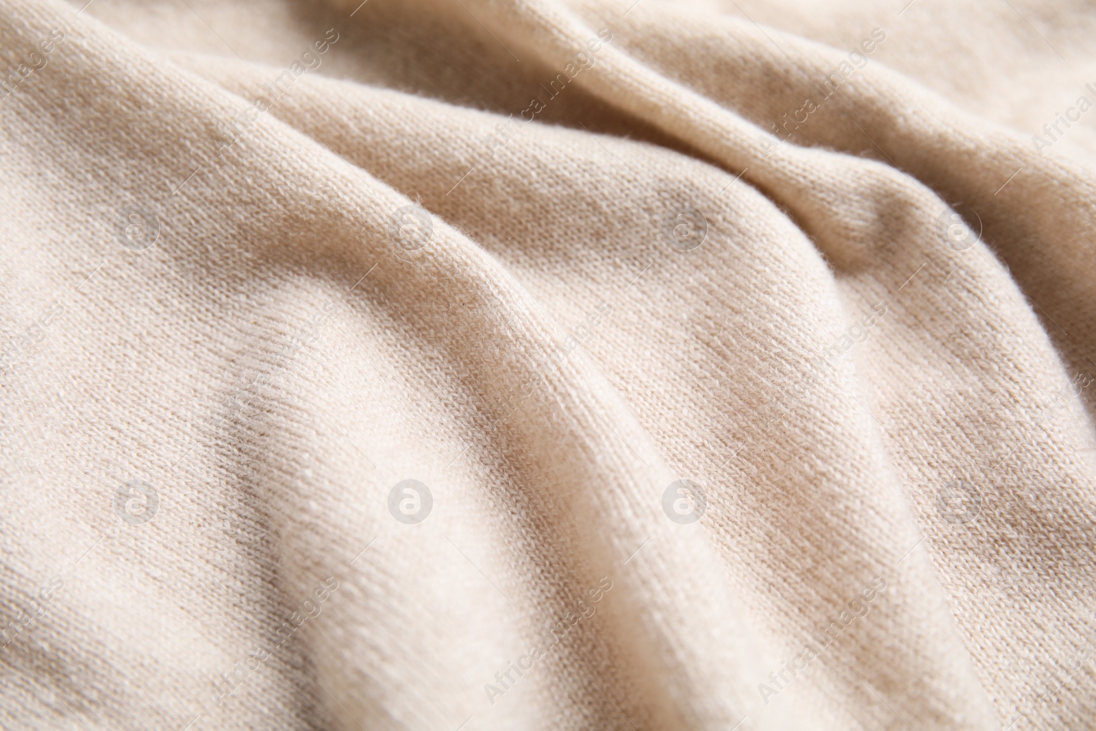 Warm cashmere sweater as background, closeup view Photo of Warm cashmere sweater as background, closeup view