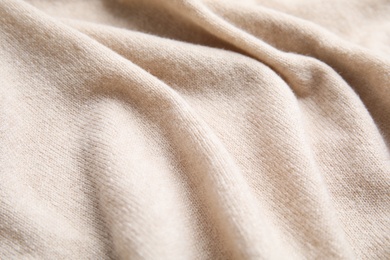 Warm cashmere sweater as background, closeup view Photo of Warm cashmere sweater as background, closeup view