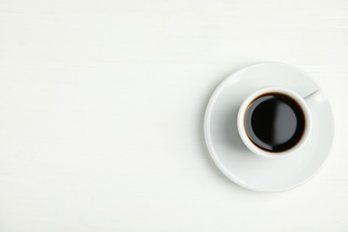 Cup of hot aromatic espresso on white background, top view Photo of Cup of hot aromatic espresso on white background, top view