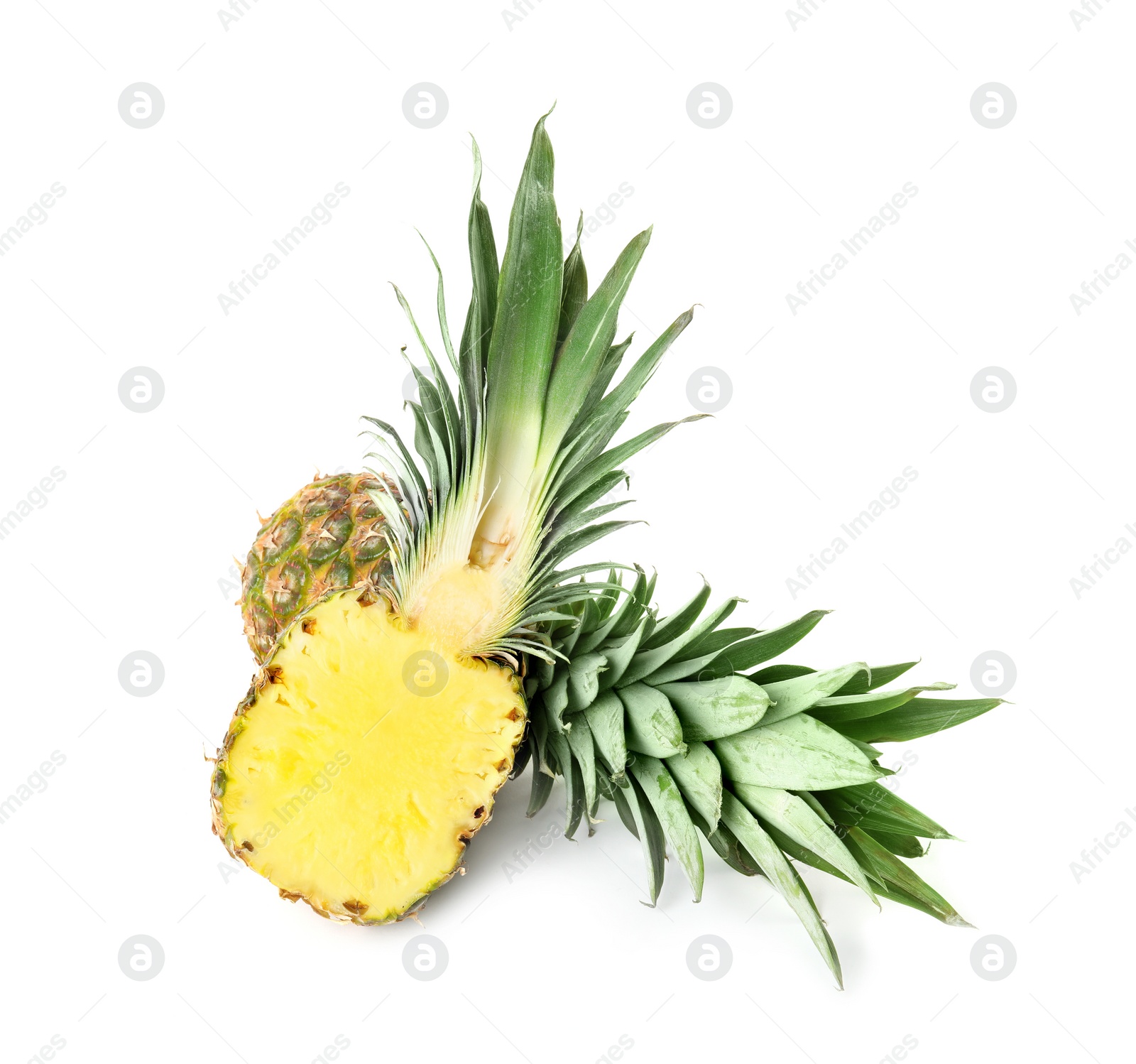 Whole and cut juicy pineapples isolated on white Photo of Whole and cut juicy pineapples isolated on white