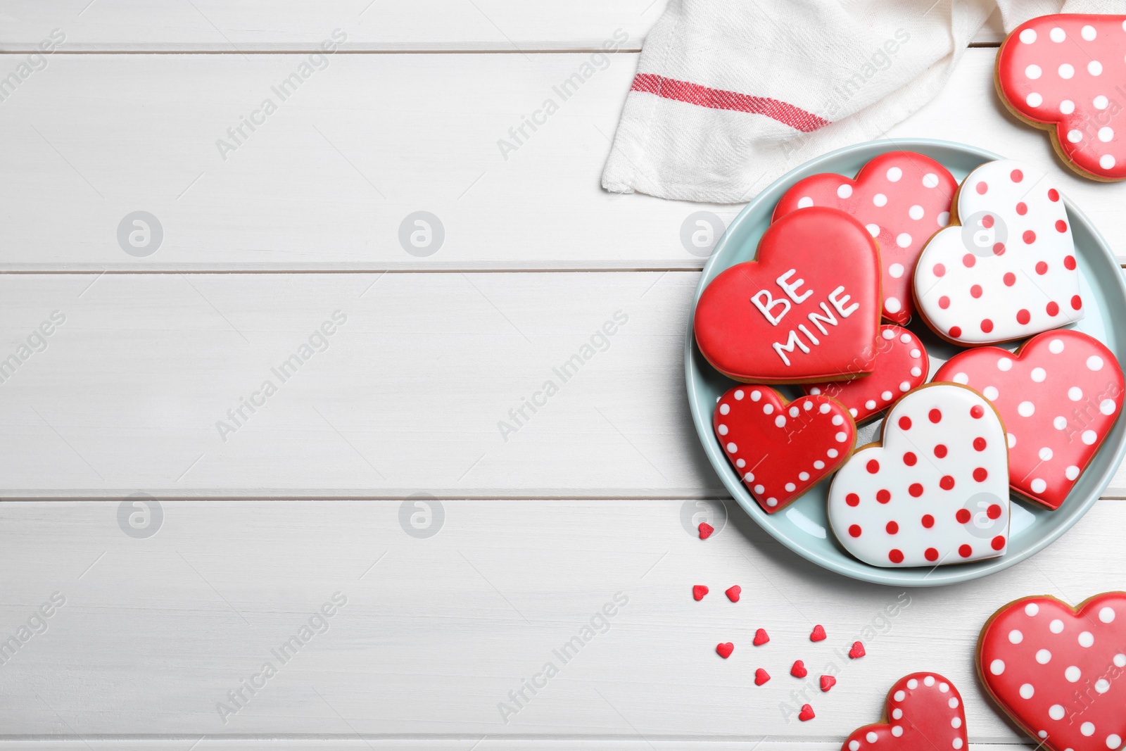 Heart shaped cookies on white wooden table, flat lay with space for text. Valentine's day treat Photo of Heart shaped cookies on white wooden table, flat lay with space for text. Valentine's day treat