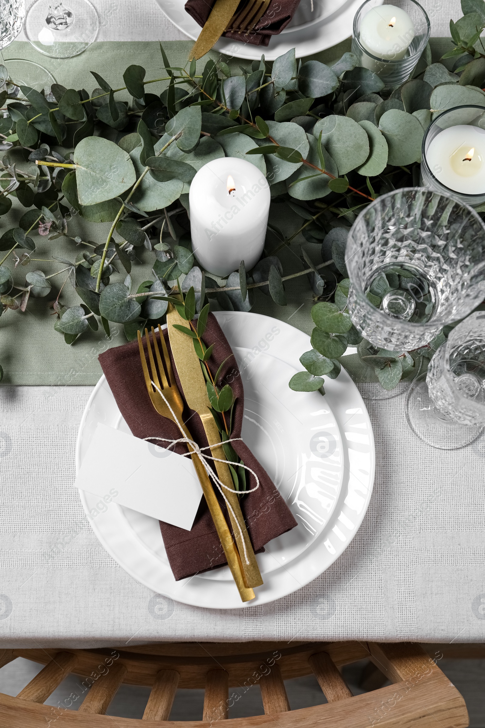 Luxury table setting with beautiful decor and blank card, flat lay. Festive dinner Photo of Luxury table setting with beautiful decor and blank card, flat lay. Festive dinner