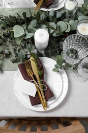 Luxury table setting with beautiful decor and blank card, flat lay. Festive dinner Photo of Luxury table setting with beautiful decor and blank card, flat lay. Festive dinner