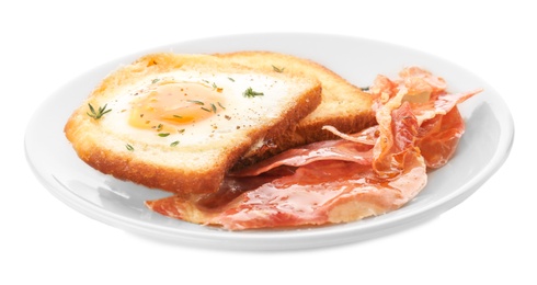 Plate with fried egg, bacon and toasts on white background Photo of Plate with fried egg, bacon and toasts on white background