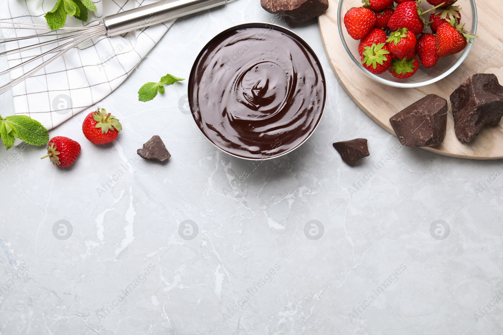 Delicious chocolate cream with strawberries and mint on light grey marble table, flat lay. Space for text Photo of Delicious chocolate cream with strawberries and mint on light grey marble table, flat lay. Space for text