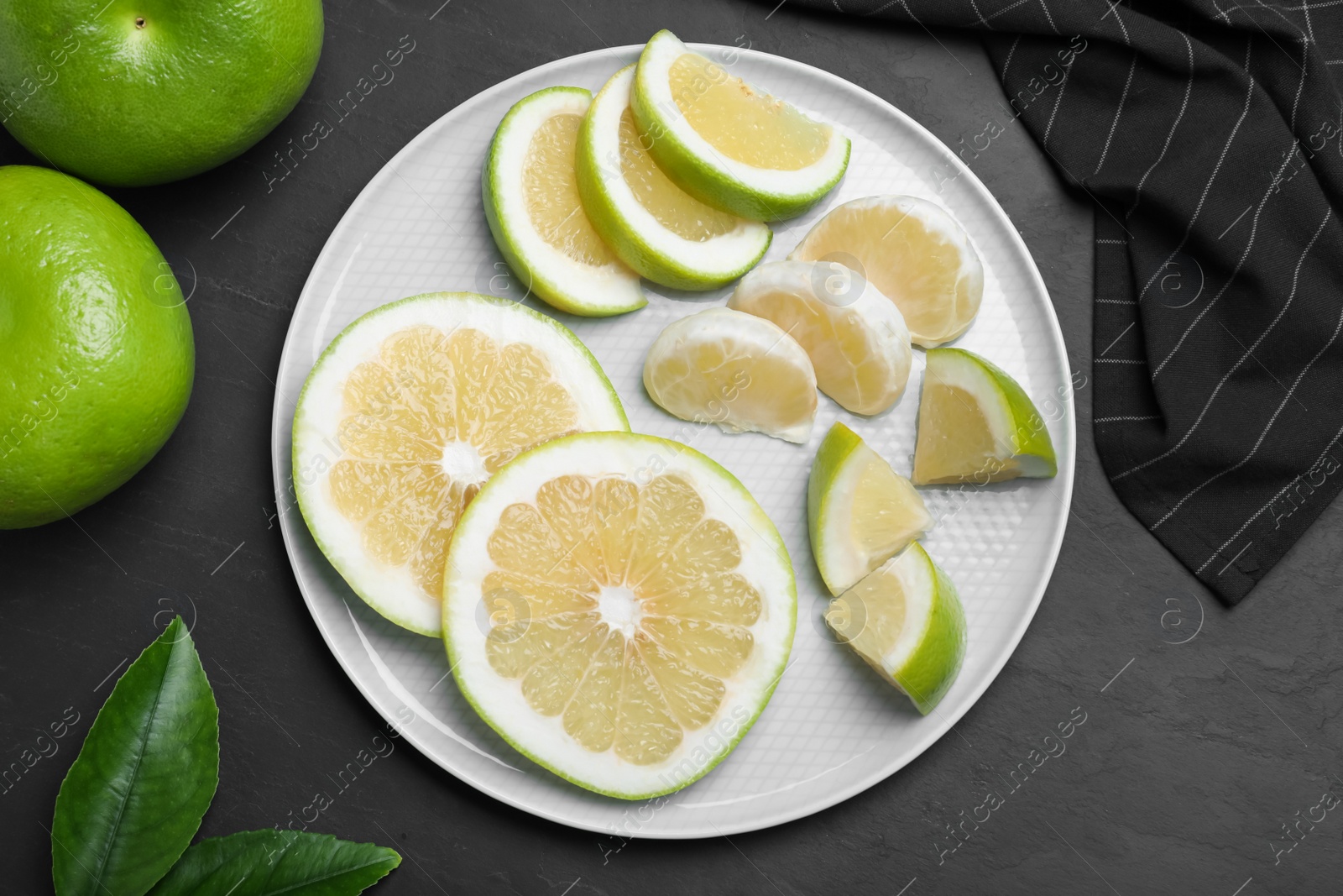 Photo of Fresh ripe sweeties on black table, flat lay
