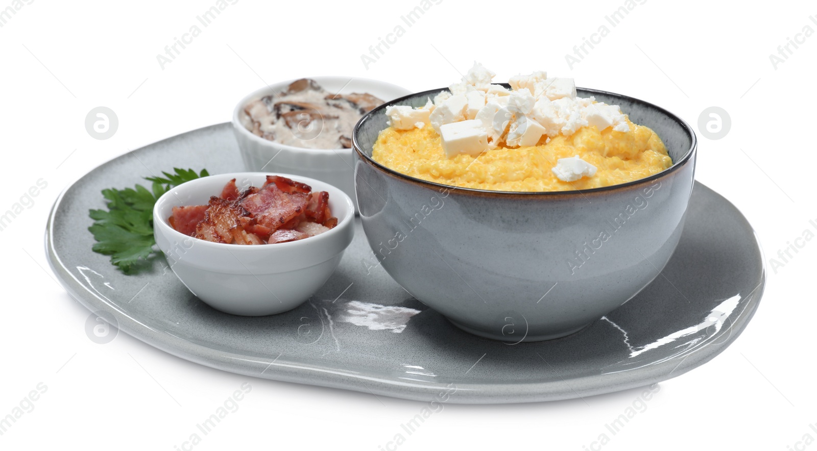 Tasty banosh with brynza, pork cracklings and mushrooms on white background. Traditional Ukrainian dish Photo of Tasty banosh with brynza, pork cracklings and mushrooms on white background. Traditional Ukrainian dish