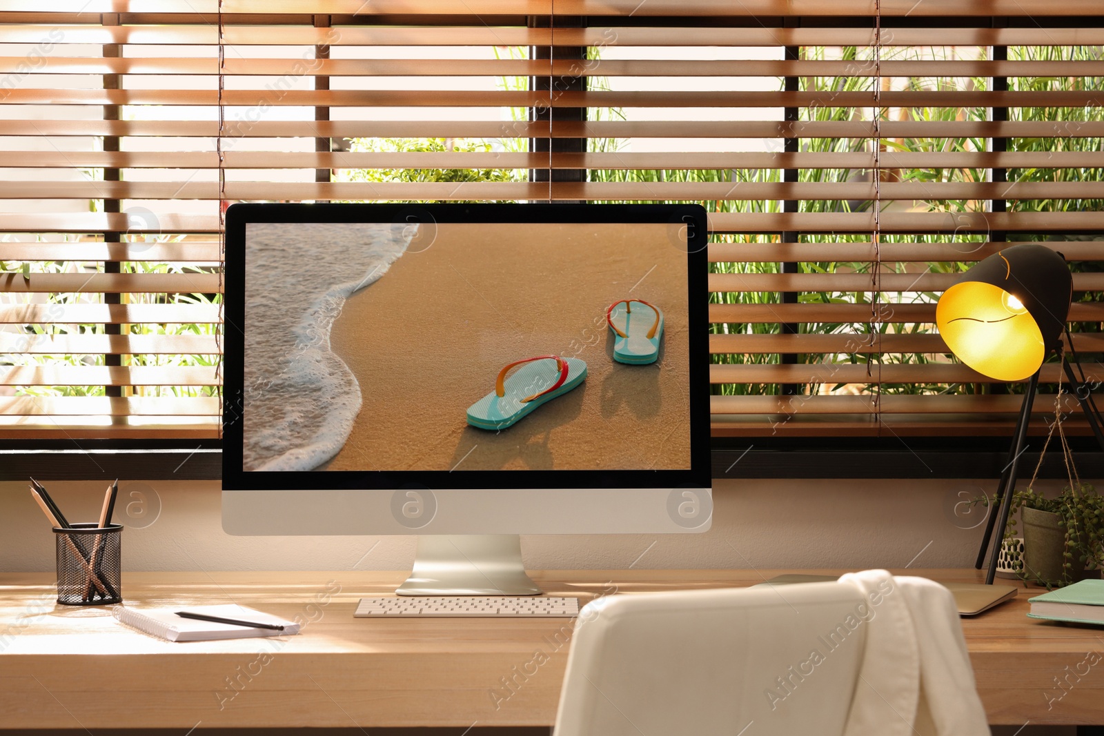 Comfortable workplace near window in room. Interior design Photo of Comfortable workplace near window in room. Interior design