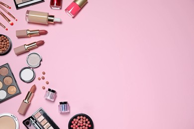 Flat lay composition with decorative cosmetics on pink background, space for text Photo of Flat lay composition with decorative cosmetics on pink background, space for text