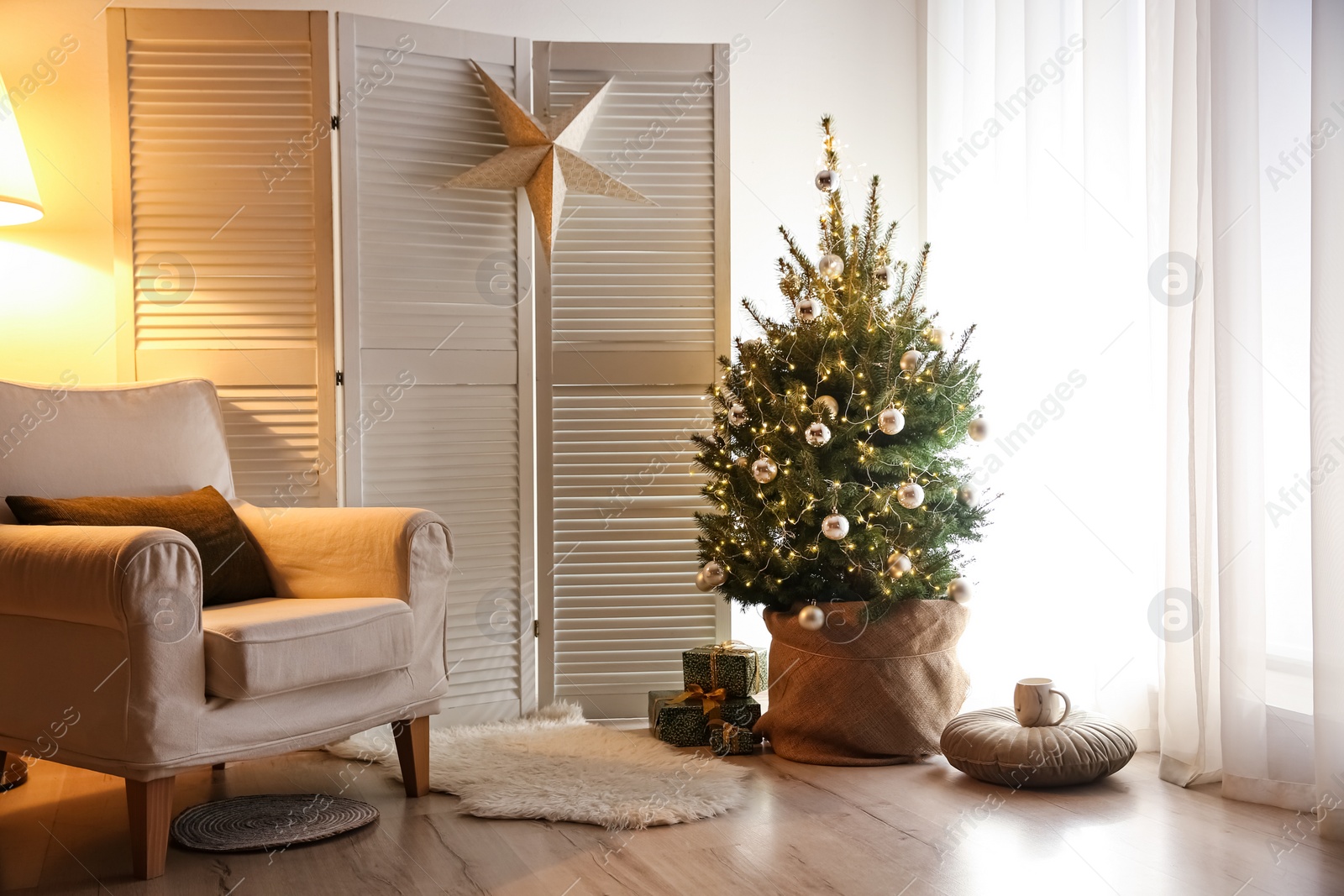 Stylish room interior with elegant Christmas decor Photo of Stylish room interior with elegant Christmas decor