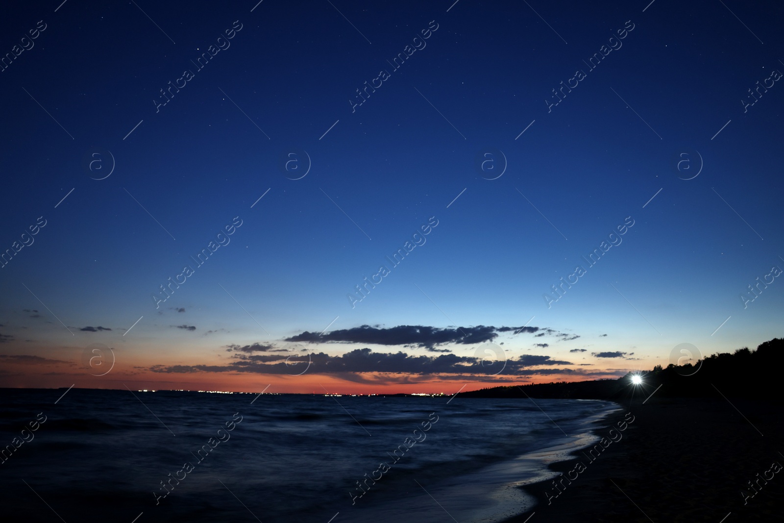 Picturesque view of beautiful sunset on seaside at night Photo of Picturesque view of beautiful sunset on seaside at night