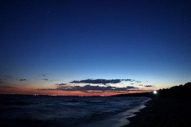 Picturesque view of beautiful sunset on seaside at night Photo of Picturesque view of beautiful sunset on seaside at night
