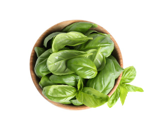 Photo of Fresh green basil leaves in wooden bowl isolated on white, top view