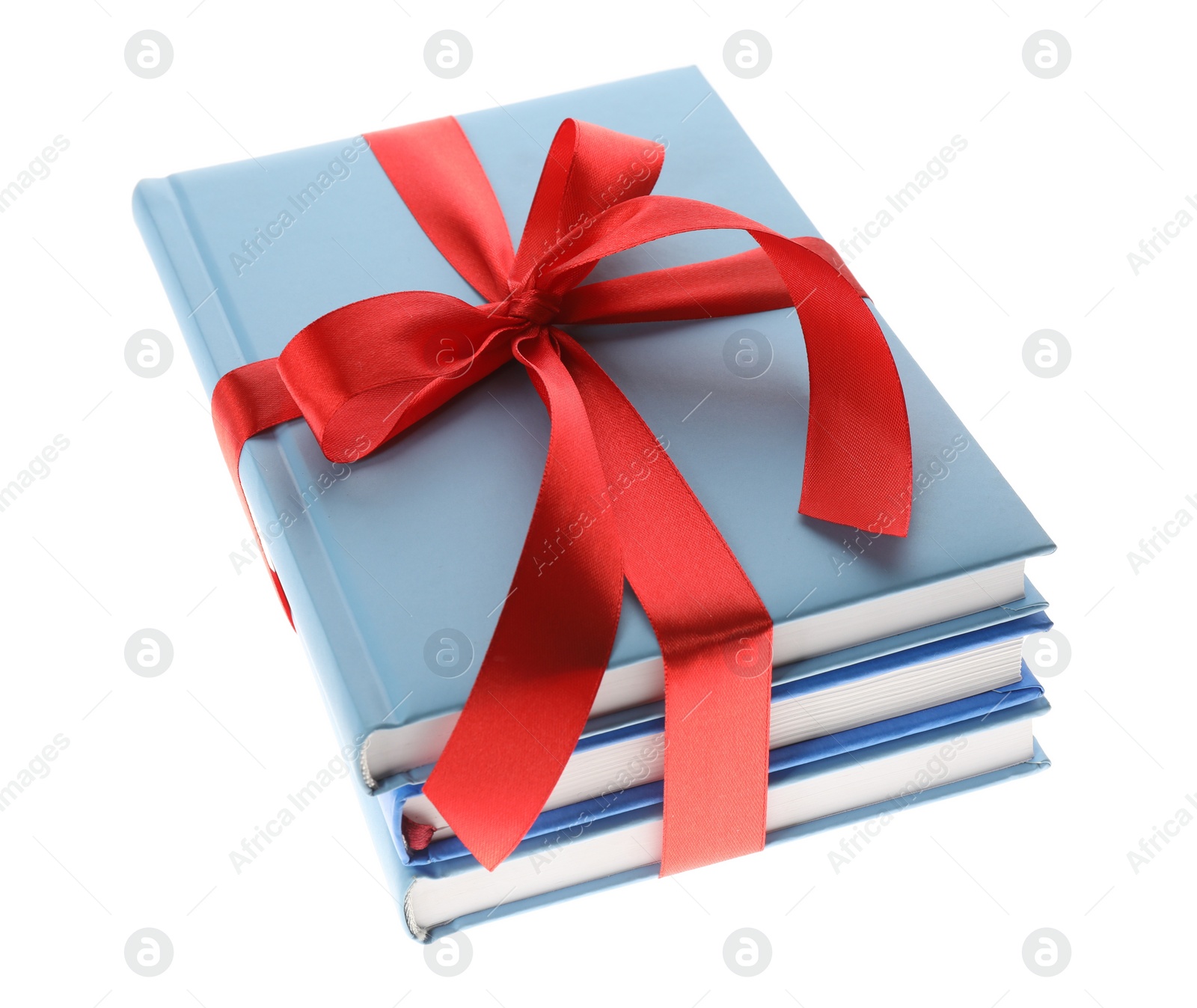 Different books tied with red ribbon isolated on white Photo of Different books tied with red ribbon isolated on white