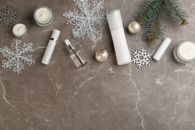 Flat lay composition with different cosmetic products on grey table, space for text. Winter care Photo of Flat lay composition with different cosmetic products on grey table, space for text. Winter care