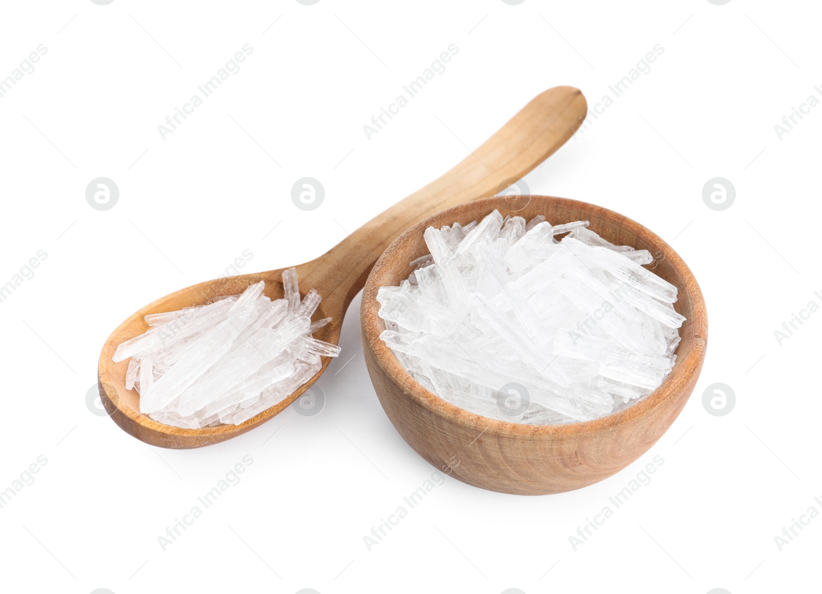 Menthol crystals in spoon and bowl on white background Photo of Menthol crystals in spoon and bowl on white background