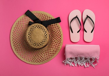 Hat, flip flops and blanket on pink background, flat lay. Beach object Photo of Hat, flip flops and blanket on pink background, flat lay. Beach object