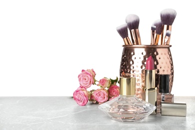 Beautiful composition with makeup products on table against white background Photo of Beautiful composition with makeup products on table against white background