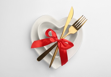 Beautiful table setting for Valentine's Day dinner on white background, top view Photo of Beautiful table setting for Valentine's Day dinner on white background, top view
