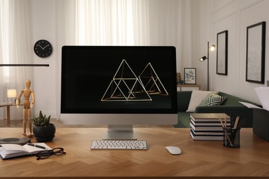 Photo of Workplace with computer on wooden desk in light room. Modern interior design