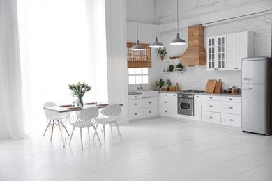 Beautiful kitchen interior with new stylish furniture Photo of Beautiful kitchen interior with new stylish furniture