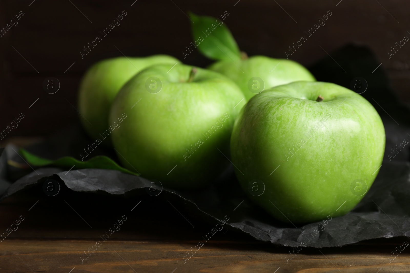 Fresh green apples on wooden table Photo of Fresh green apples on wooden table