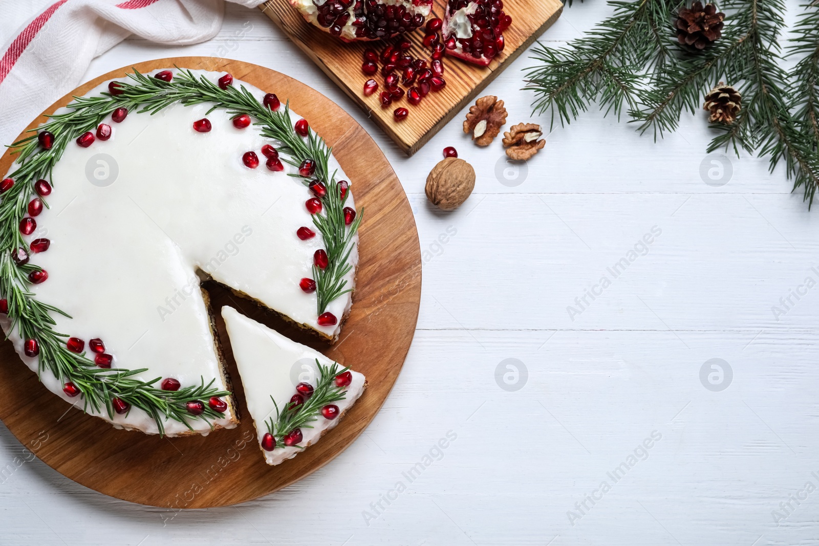 Flat lay composition with traditional Christmas cake on white wooden table. Space for text Photo of Flat lay composition with traditional Christmas cake on white wooden table. Space for text