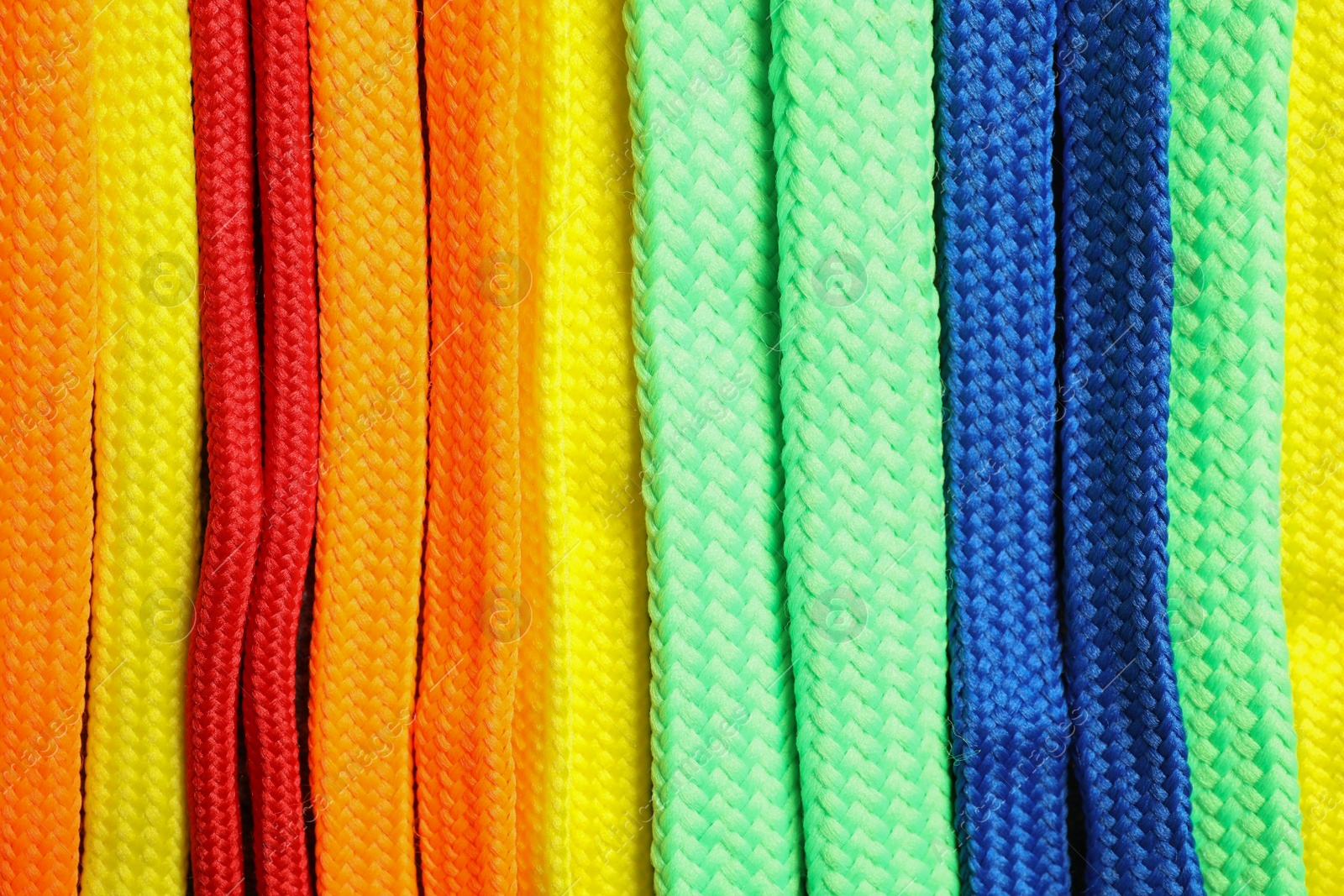 Colorful shoelaces as background, closeup. Stylish accessory Photo of Colorful shoelaces as background, closeup. Stylish accessory