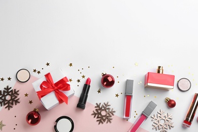 Flat lay composition with decorative cosmetic products on color background, space for text. Winter care Photo of Flat lay composition with decorative cosmetic products on color background, space for text. Winter care