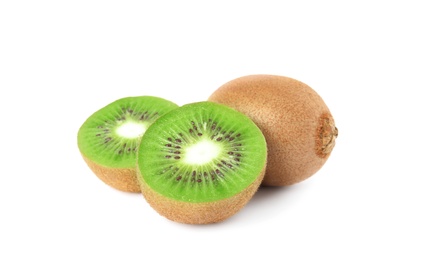 Cut and whole fresh kiwis on white background Photo of Cut and whole fresh kiwis on white background