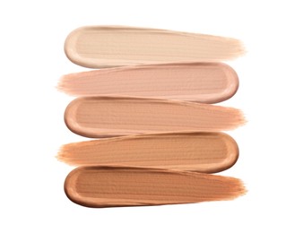 Different shades of liquid skin foundation on white background, top view Image of Different shades of liquid skin foundation on white background, top view