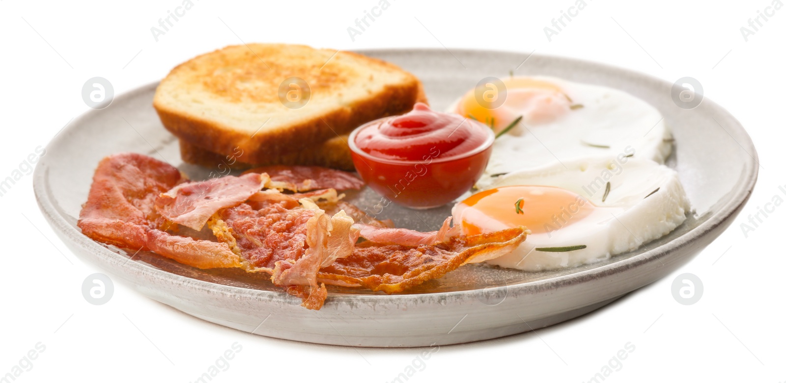 Plate with fried eggs, bacon, toasts and sauce on white background Photo of Plate with fried eggs, bacon, toasts and sauce on white background