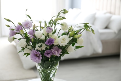 Beautiful bouquet with Eustoma flowers in bedroom Photo of Beautiful bouquet with Eustoma flowers in bedroom